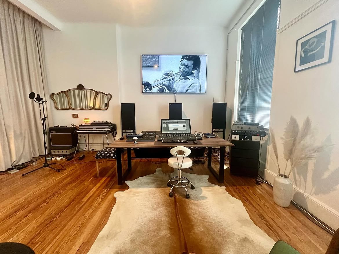 The mixing desk with monitors and outboard gear in the studio